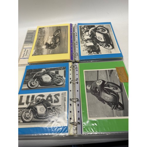 22 - A folder of coloured and black and white photographs bearing signatures comprising:- Geoff Duke, Mik... 