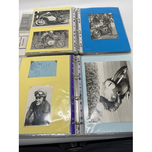 22 - A folder of coloured and black and white photographs bearing signatures comprising:- Geoff Duke, Mik... 