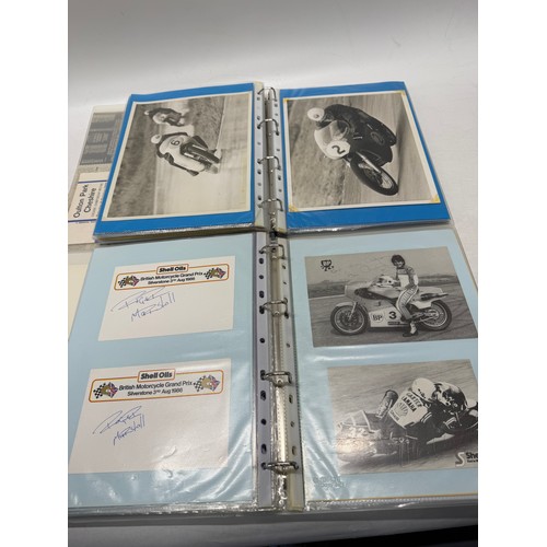 22 - A folder of coloured and black and white photographs bearing signatures comprising:- Geoff Duke, Mik... 