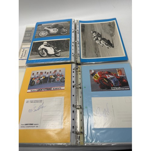 22 - A folder of coloured and black and white photographs bearing signatures comprising:- Geoff Duke, Mik... 