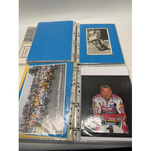 22 - A folder of coloured and black and white photographs bearing signatures comprising:- Geoff Duke, Mik... 