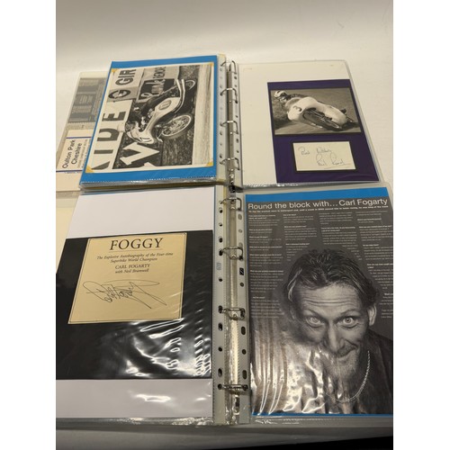 22 - A folder of coloured and black and white photographs bearing signatures comprising:- Geoff Duke, Mik... 