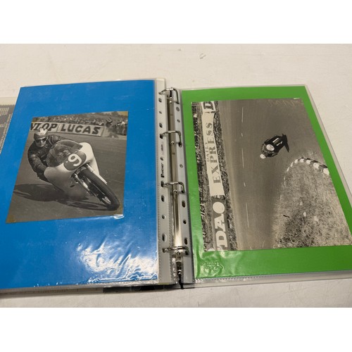22 - A folder of coloured and black and white photographs bearing signatures comprising:- Geoff Duke, Mik... 