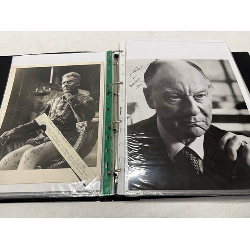 23 - A folder of coloured and black and white photographs bearing signatures comprising:- Aiden Turner, J... 