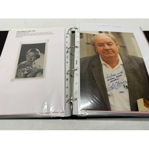 23 - A folder of coloured and black and white photographs bearing signatures comprising:- Aiden Turner, J... 
