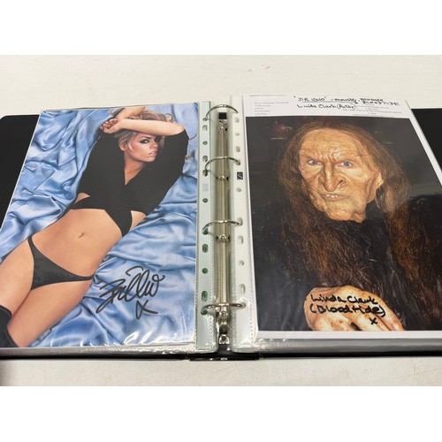 23 - A folder of coloured and black and white photographs bearing signatures comprising:- Aiden Turner, J... 