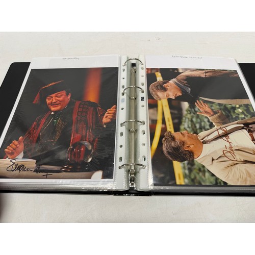 23 - A folder of coloured and black and white photographs bearing signatures comprising:- Aiden Turner, J... 
