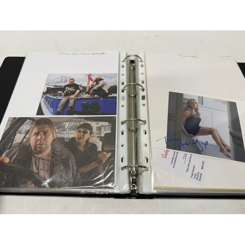 23 - A folder of coloured and black and white photographs bearing signatures comprising:- Aiden Turner, J... 