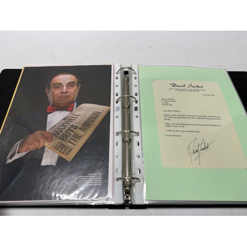 23 - A folder of coloured and black and white photographs bearing signatures comprising:- Aiden Turner, J... 
