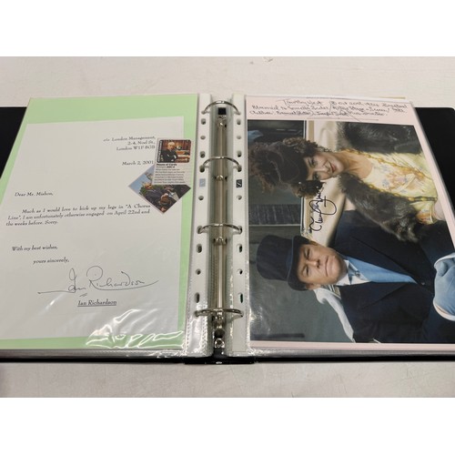 23 - A folder of coloured and black and white photographs bearing signatures comprising:- Aiden Turner, J... 