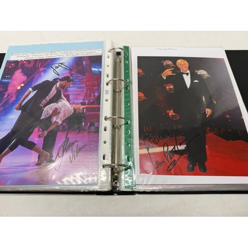 23 - A folder of coloured and black and white photographs bearing signatures comprising:- Aiden Turner, J... 