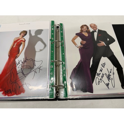23 - A folder of coloured and black and white photographs bearing signatures comprising:- Aiden Turner, J... 