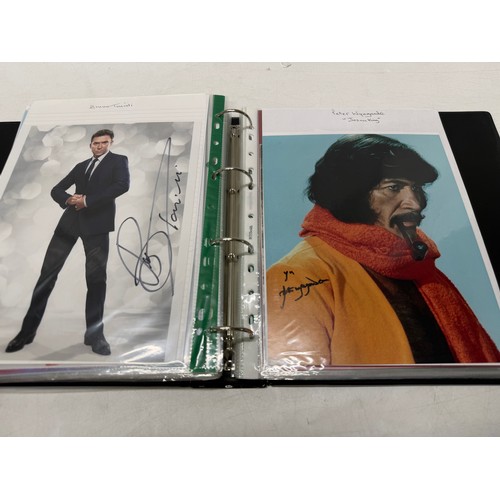 23 - A folder of coloured and black and white photographs bearing signatures comprising:- Aiden Turner, J... 