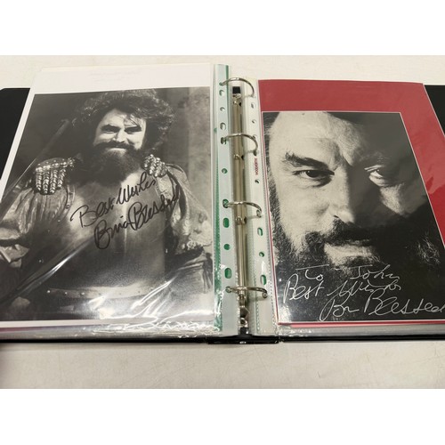 23 - A folder of coloured and black and white photographs bearing signatures comprising:- Aiden Turner, J... 