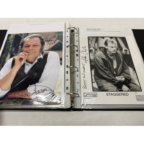 23 - A folder of coloured and black and white photographs bearing signatures comprising:- Aiden Turner, J... 