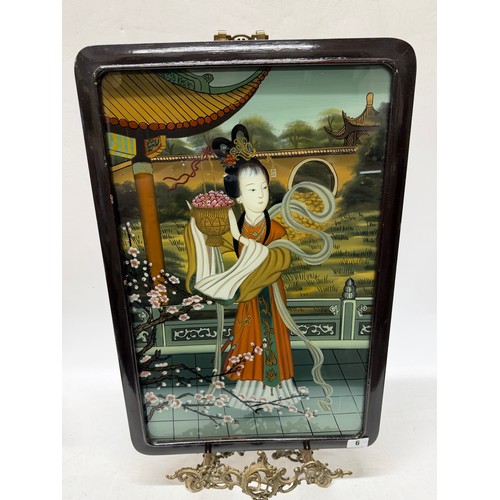 6 - A Chinese reverse painting on glass of a lady holding a basket with prunus flowers to the foreground... 