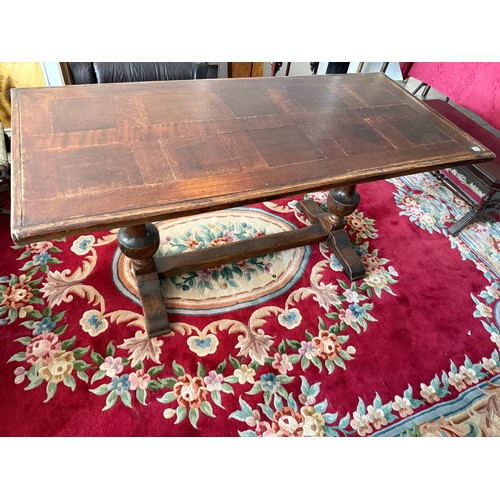 51 - An oak refectory table with rectangular top, on turned supports and straight stretchers - 64in. x 29... 