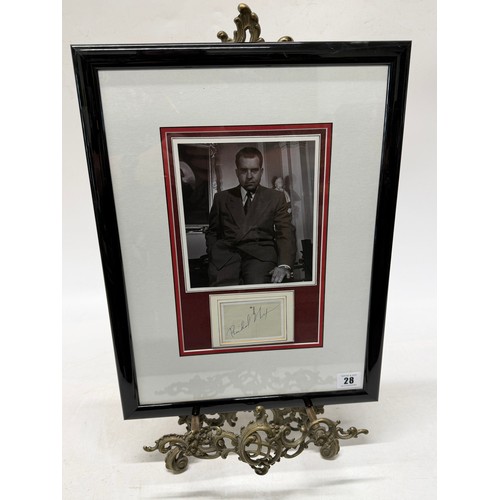 28 - A black and white photograph of Richard Nixon, bearing signature, framed and glazed