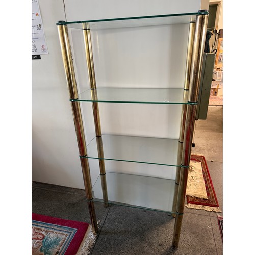 45 - A set of glass and brass five tier shelves - 24in. wide