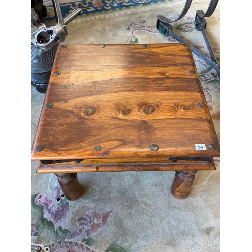 65 - An Eastern hardwood coffee table with square top, on turned legs, metal mounts - 23 1/2in. square