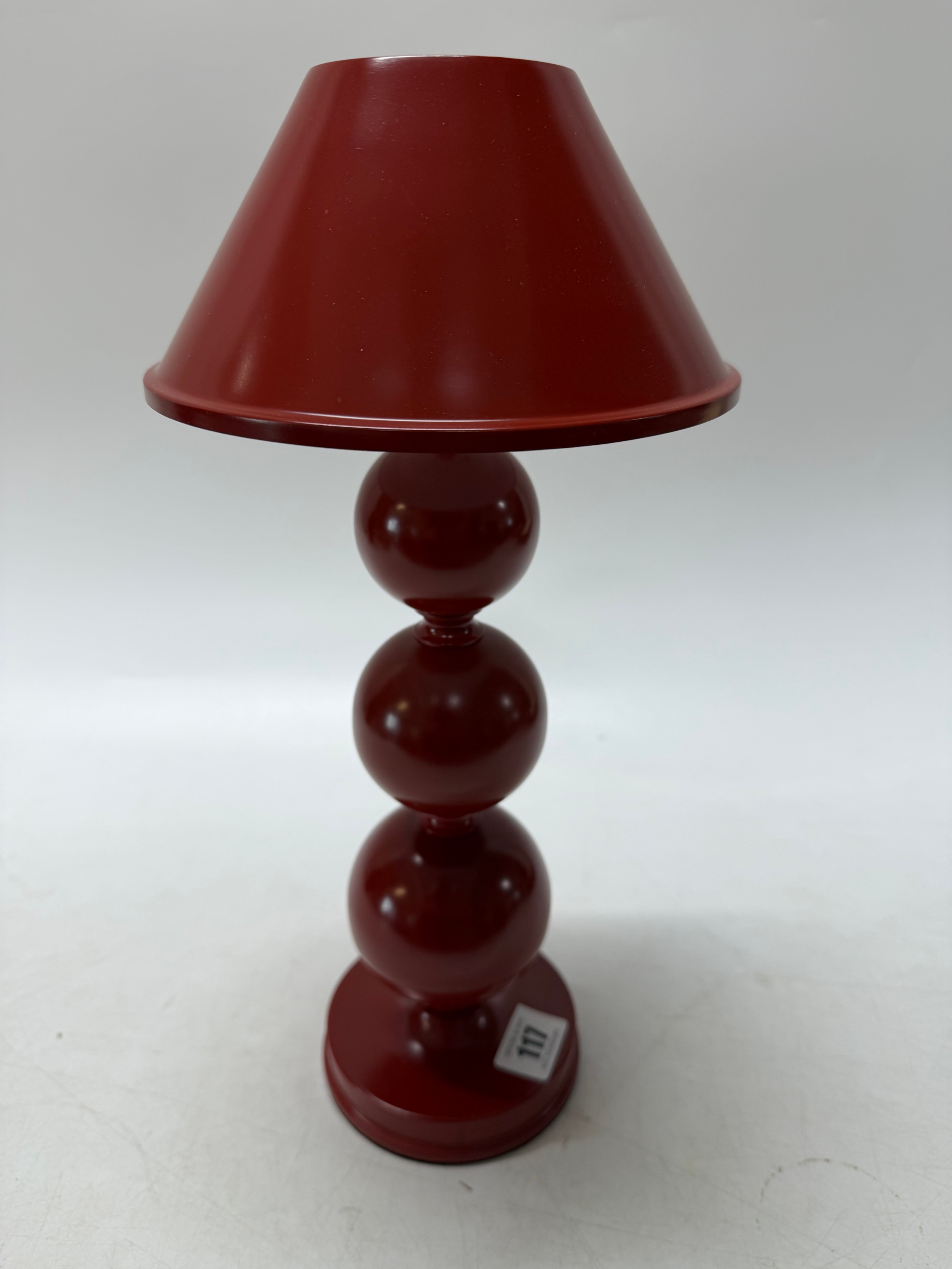 A Triya Wireless Oka modern red tablelamp in the form of three spheres ...
