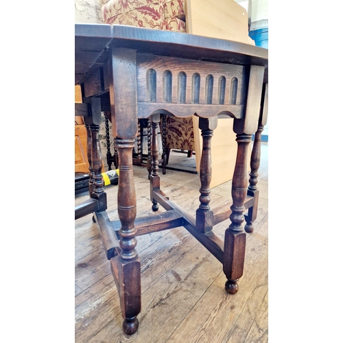 320 - Oak oval gateleg table on baluster turned legs