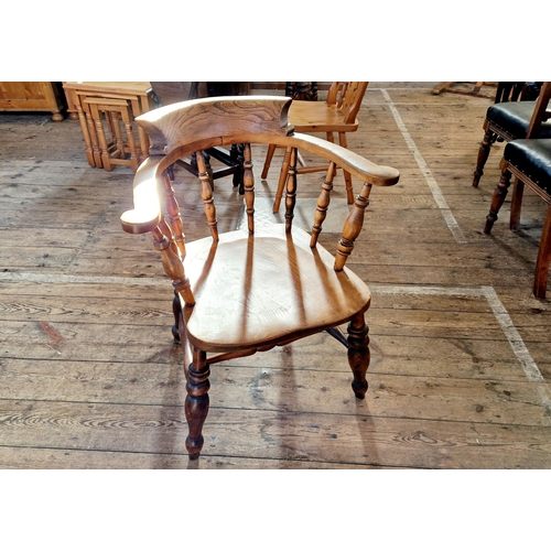 Early 20th century oak spindle back tub chair on turned supports