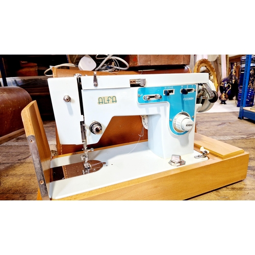 132 - Alfa blue electric sewing machine and Ace cordless telephone