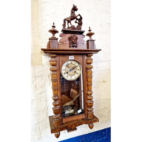 144 - Early 20th century mahogany cased wall clock with horse pediment