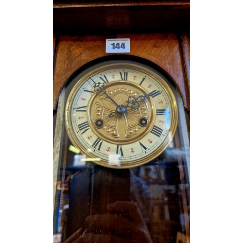 144 - Early 20th century mahogany cased wall clock with horse pediment