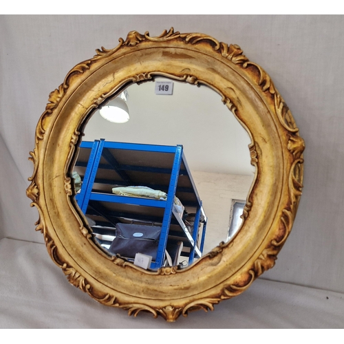 149 - Modern circular wall mirror in ornate gilt frame