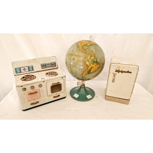 171 - Three vintage toys comprising tin plate dolls range and refrigerator and Philips relief globe