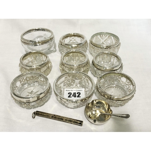 242 - Collection of nine silver rimmed glass salts, various dates and assay; Birmingham silver salt spoon;... 