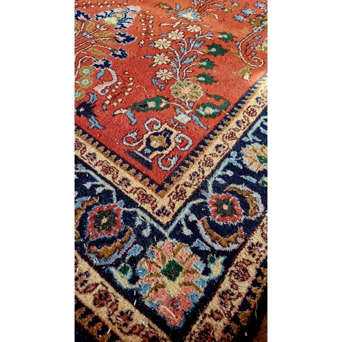 245 - Floral patterned blue and pink woollen rug, c. 65