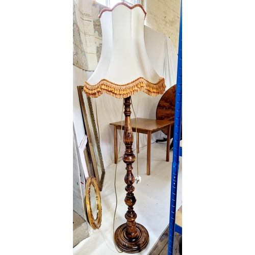 254 - Carved mahogany standard lamp, with turned baluster column and circular base