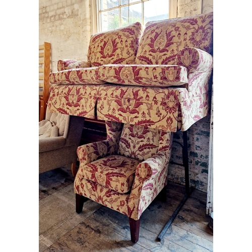 272 - MultiYork patterned two piece suite of two seater settee and winged armchair