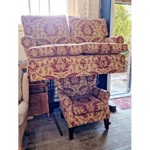 272 - MultiYork patterned two piece suite of two seater settee and winged armchair