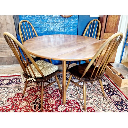 322 - Ercol oval drop leaf dining table and 4 Ercol Quaker chairs