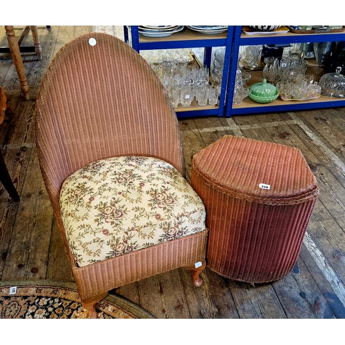 330 - Two pieces of wicker furniture - a nursing chair and Sirrom linen basket