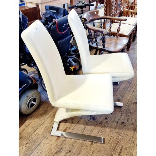 344 - Pair of retro style dining chairs in cream leatherette and chrome