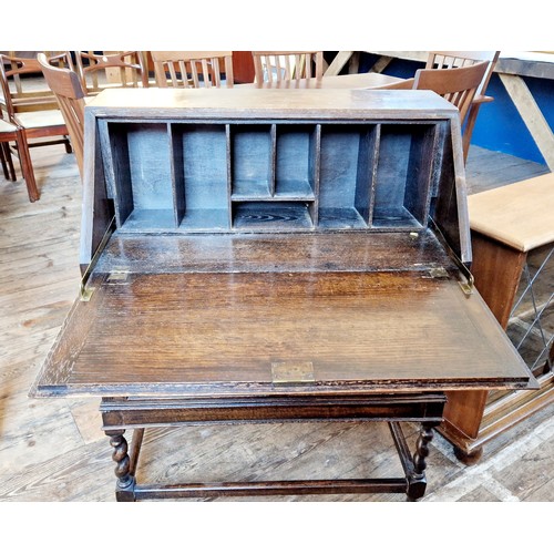 386 - Early 20th century oak bureau with geometric relief panels on barley twist legs