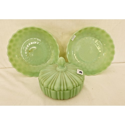 39 - Three items of frilly green vaseline glass, two bowls and covered jar