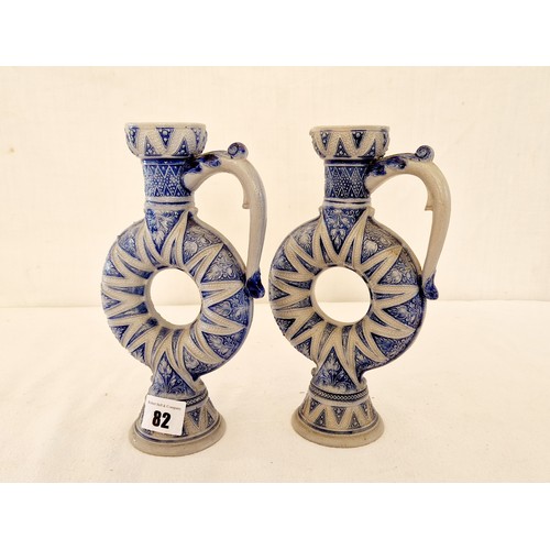 82 - Pair of Westerwald salt glazed stoneware blue and white donut jugs