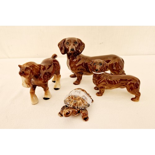 95 - Four animal figurines, two gloss Dachshunds, gloss shire horse and Wade tortoise