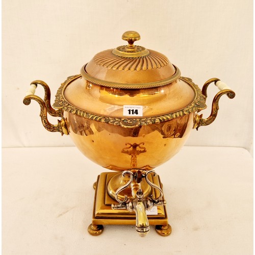 114 - Copper samovar with shell and scroll edging on square pedestal base, various dents
