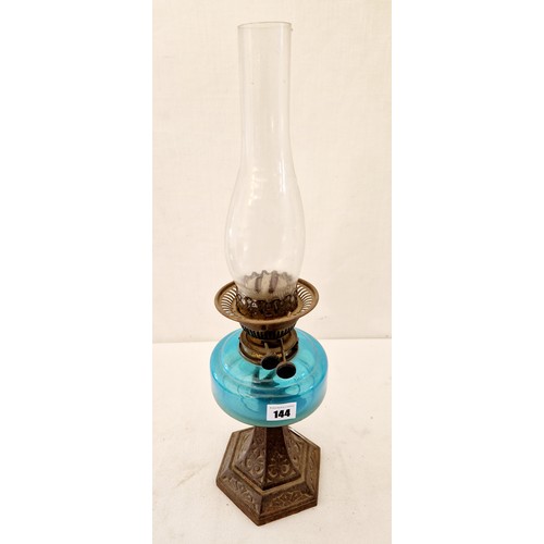 144 - Edwardian oil lamp with glass reservoir on cast metal base and modern Tilley lamp