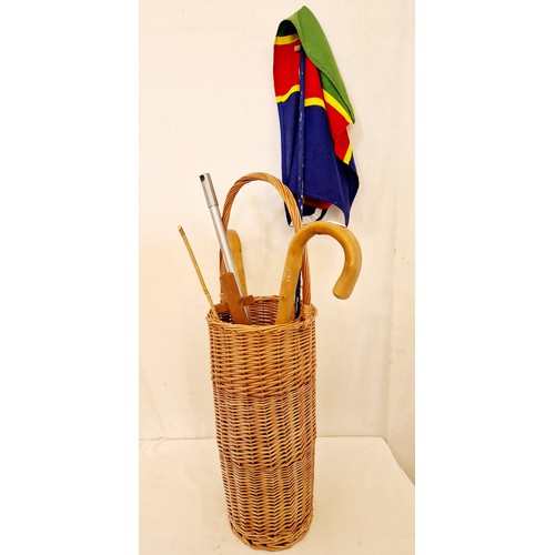 161 - Wicker cylindrical stick stand, walking sticks, Lincolnshire flag etc