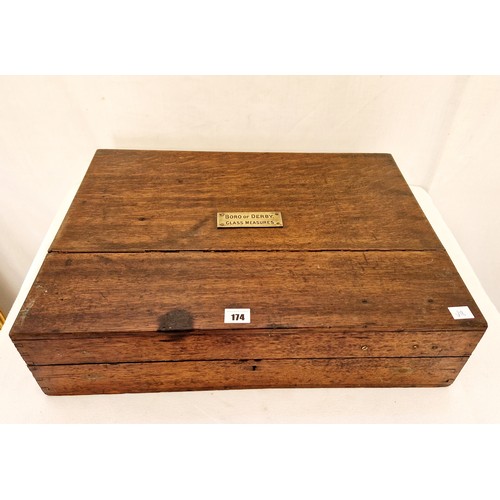 174 - Oak lidded cabinet with brass plaque, Boro of Derby Glass Measures, and fitted interior