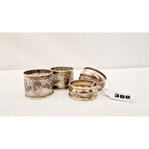 306 - Two pairs of silver napkin rings, Birmingham 1899 with pierced gallery & blank 
cartouches & a match... 