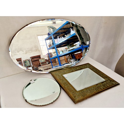 316 - Oval and circular frameless wall mirrors and rectangular relief brass framed mirror